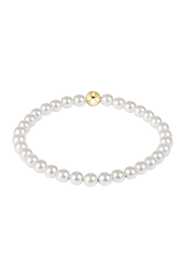 Pearl bracelet with a gold clasp on a white background. gold. silver. enewton. tarnishfree. metallic. stackable. bracelets.