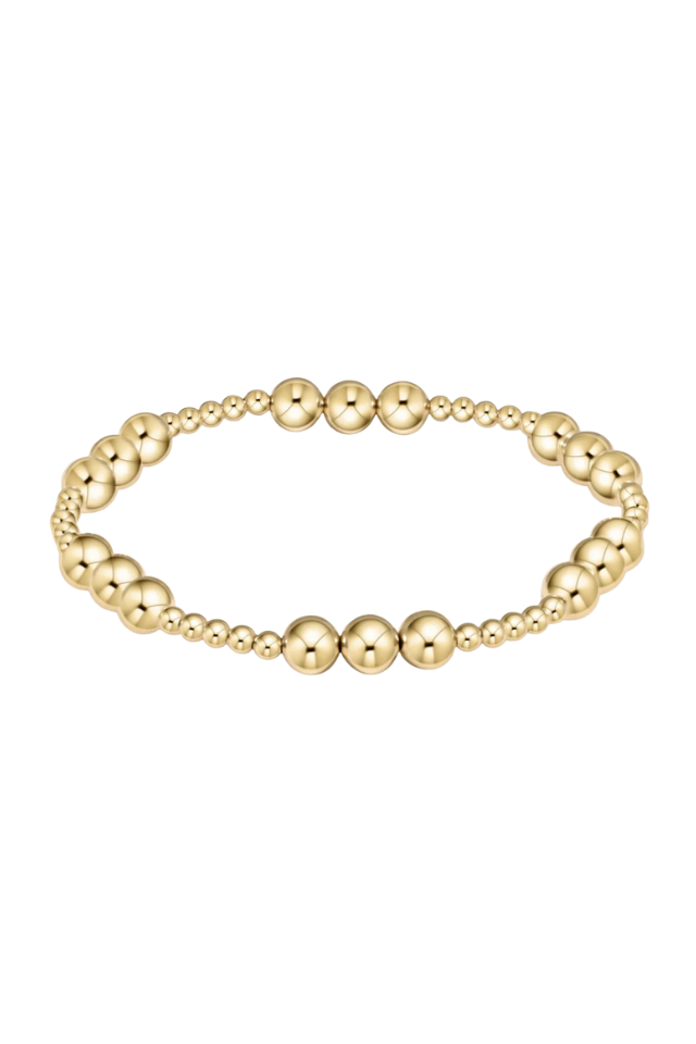 Gold beaded bracelet on a white background Gold beaded bracelet on a white background. enewton. 14k gold, tarnish free. low price. 