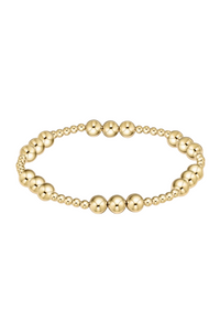 Gold beaded bracelet on a white background Gold beaded bracelet on a white background. enewton. 14k gold, tarnish free. low price. 