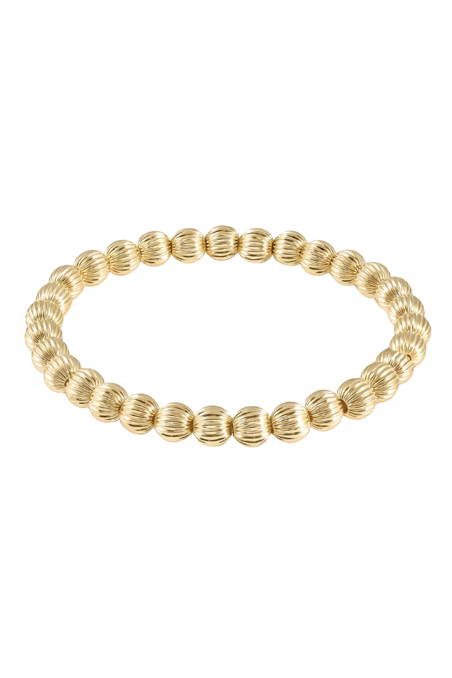 Gold bracelet on a white background. Gold beaded bracelet on a white background. enewton. 14k gold, tarnish free. low price. 