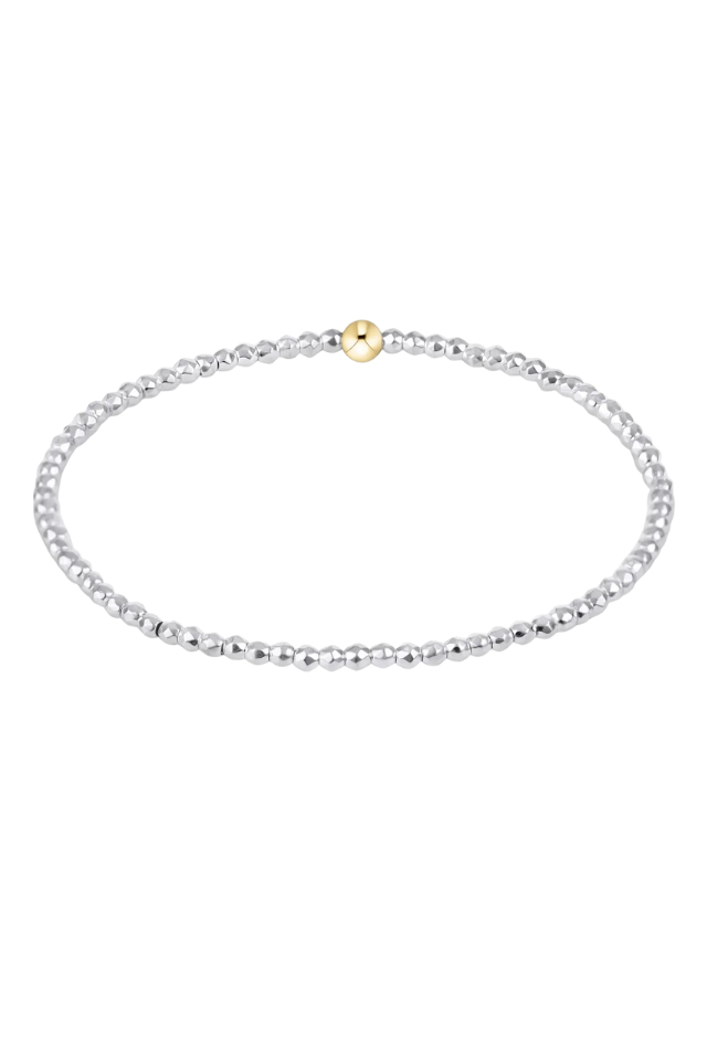 Silver beaded necklace with a gold clasp on a white background. gold. silver. enewton. tarnishfree. metallic. stackable. bracelets.