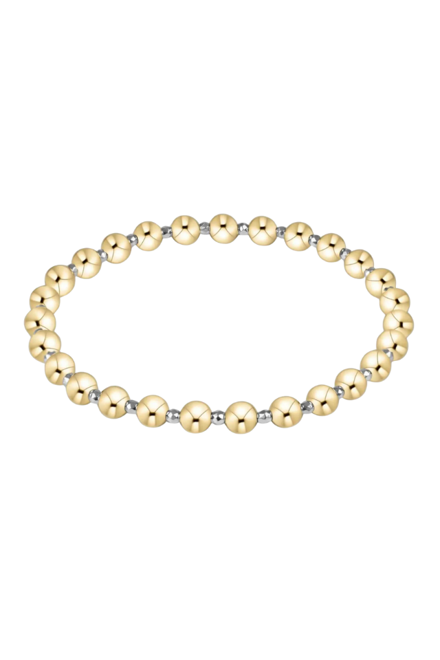 Gold beaded bracelet on a white background. gold. silver. enewton. tarnishfree. metallic. stackable. bracelets.