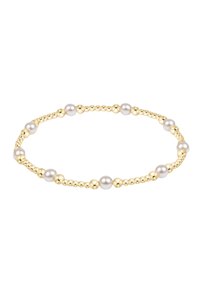 Gold bracelet with pearls on a white background.enewton Classic Purpose Pattern 4mm Bead Bracelet - Pearl