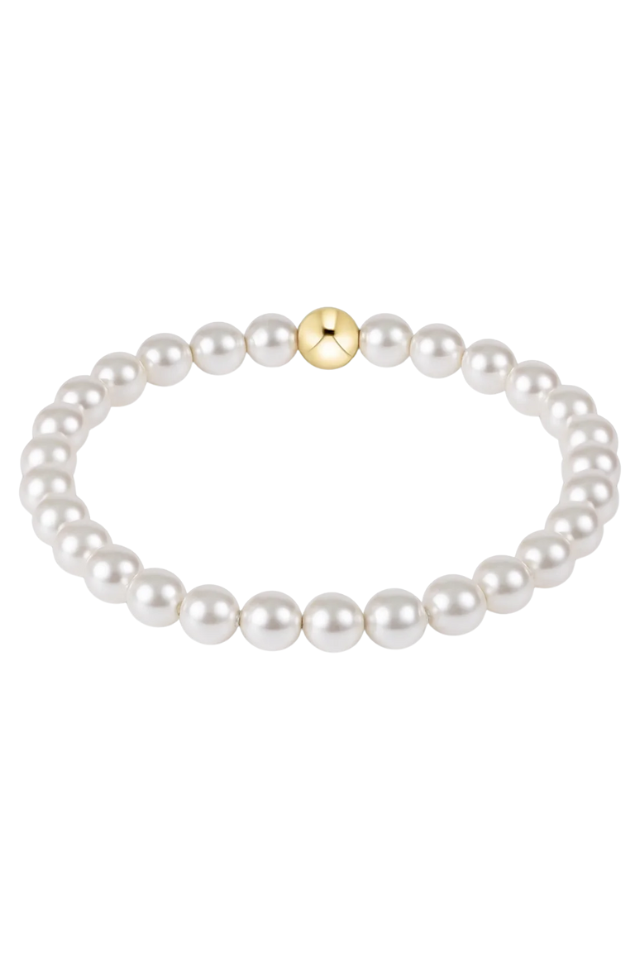 Pearl bracelet with a gold clasp on a white background. gold. silver. enewton. tarnishfree. metallic. stackable. bracelets.