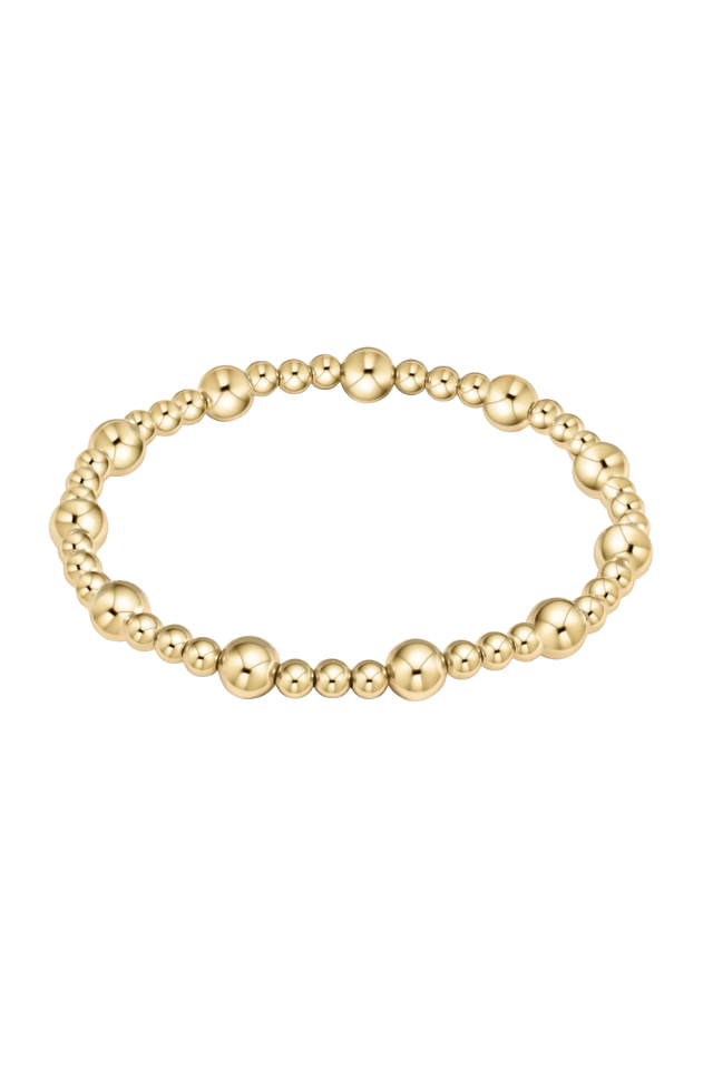 Gold beaded bracelet on a white background. Gold beaded bracelet on a white background. enewton. 14k gold, tarnish free. low price. 